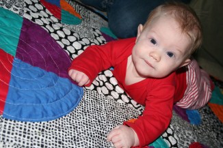 Evan on his new quilt