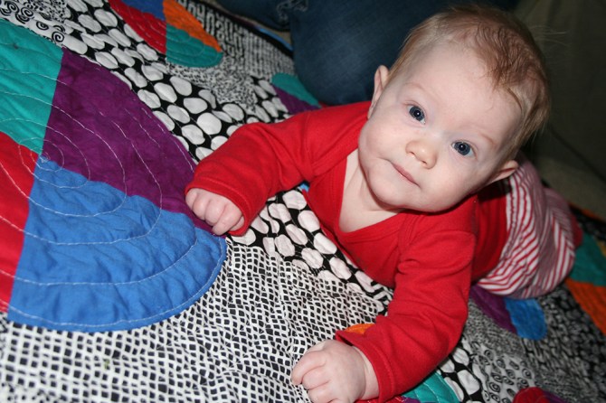 Evan on his new quilt
